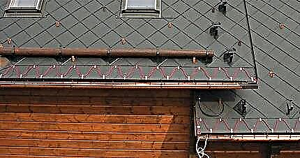 Pemanasan selokan: pemasangan atap dan sistem pemanasan saluran air